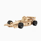 A high-detailed 3D wooden puzzle model of a Formula 1 racing car, featuring intricate laser-cut mechanical parts on a white background.
