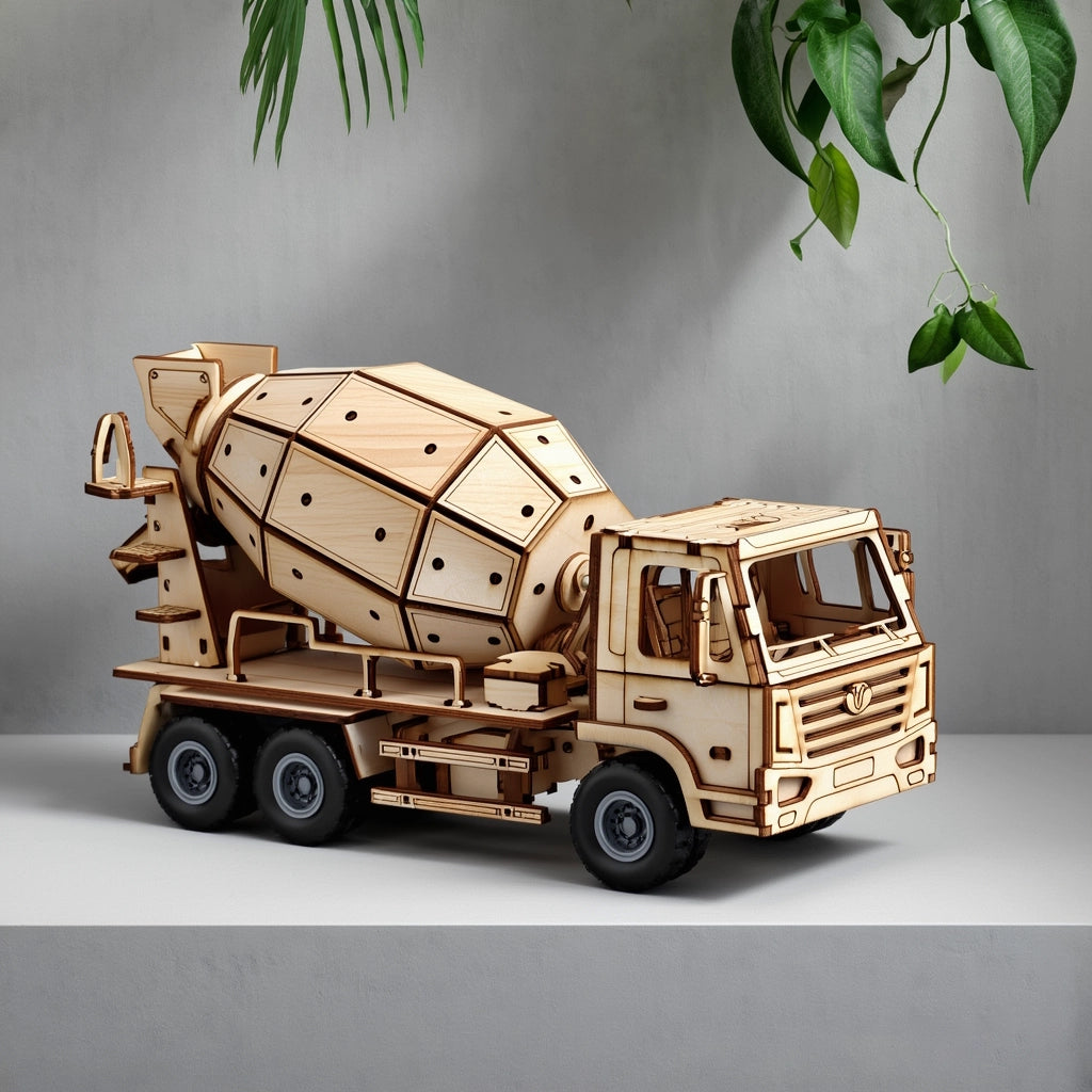 The completed Dilruo 3D wooden cement mixer truck displayed as a sophisticated desk ornament in a modern home setting with natural greenery.
