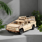 Assembled wooden cyber pickup truck model displayed as a modern desktop ornament in a home office setting.
