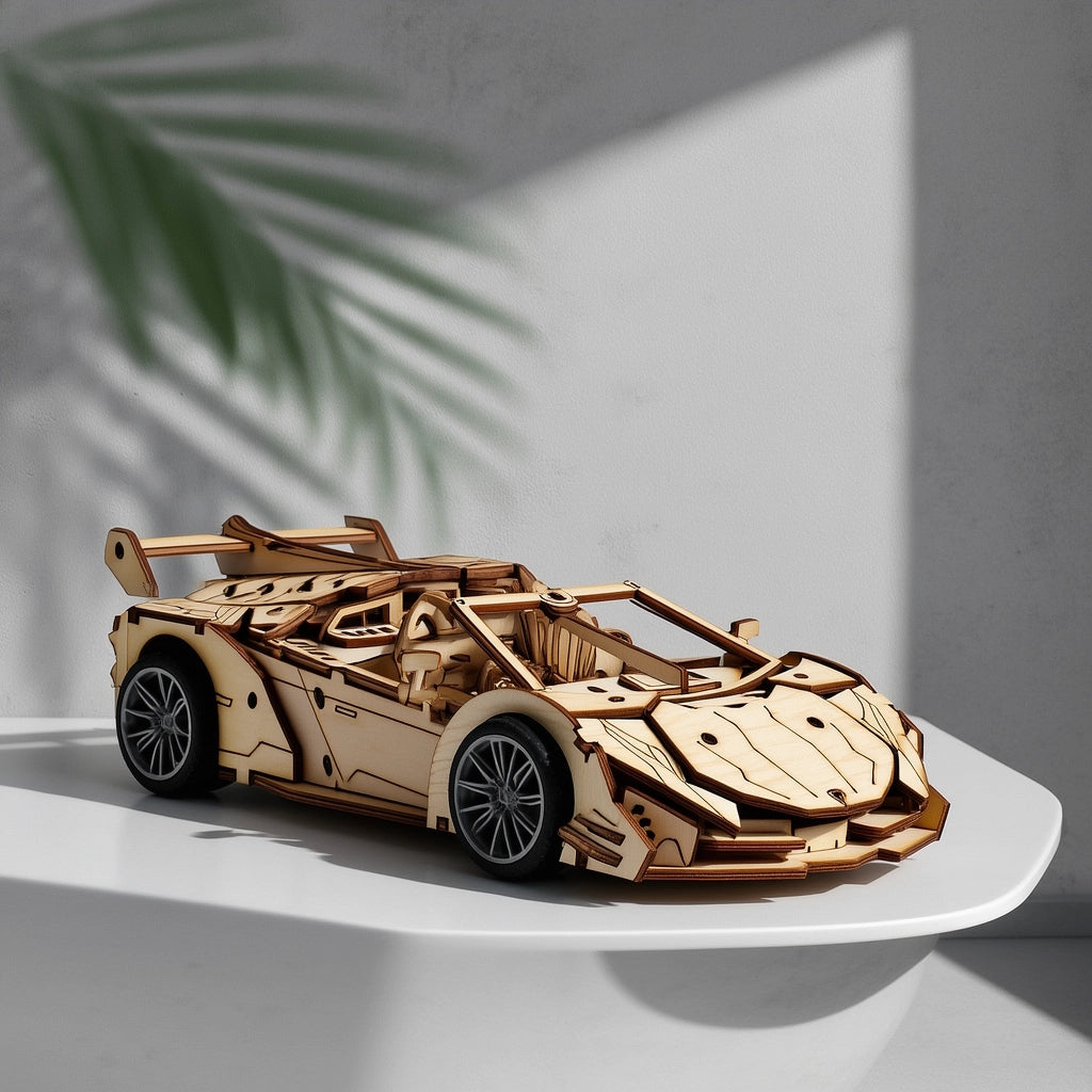 Assembled wooden supercar model displayed as a sophisticated decorative piece on a modern home office desk.