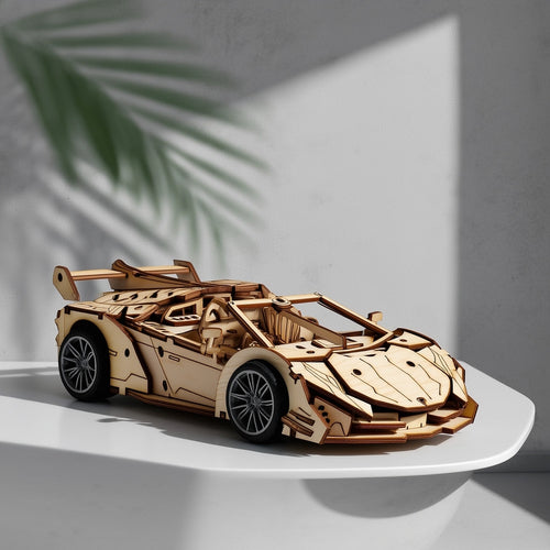 Assembled wooden supercar model displayed as a sophisticated decorative piece on a modern home office desk.
